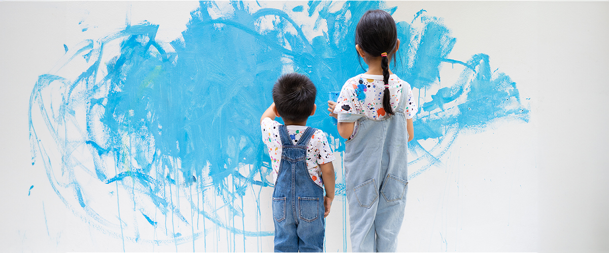 two-kids-painting-the-walls