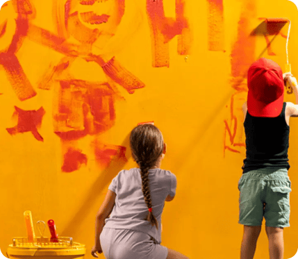 two-kids-painting-the-walls