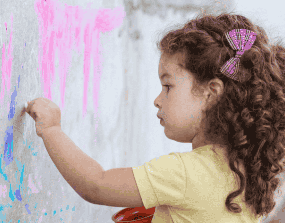 Kid drawing on wall