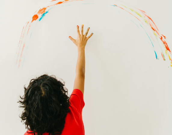 Kid drawing on wall