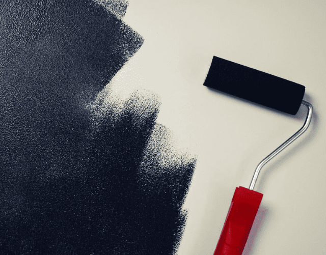Paint roller on wall